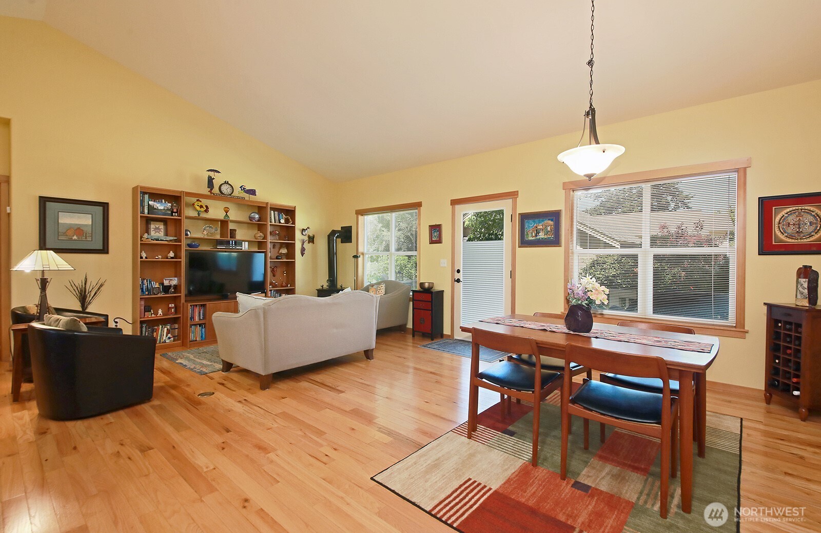 1050 Village Loop Langley, WA 98260 - Photo 28 of 39 a living room with furniture and a flat screen tv