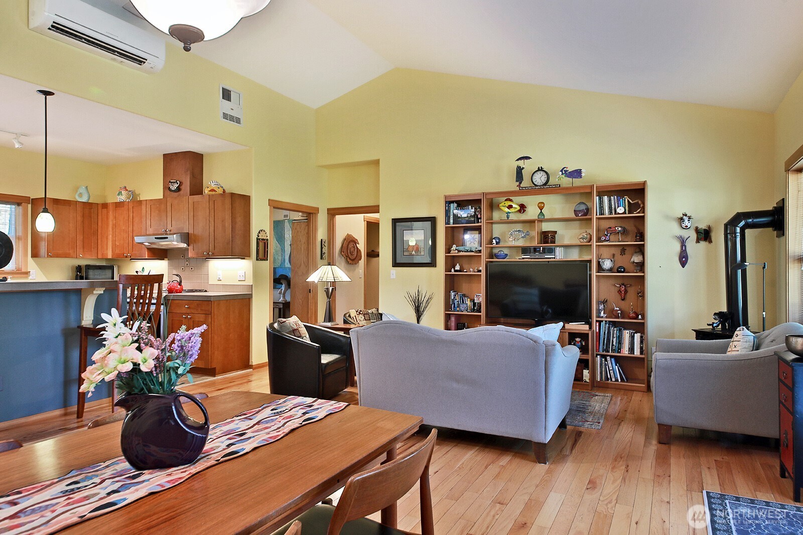 1050 Village Loop Langley, WA 98260 - Photo 29 of 39 a living room with furniture and a flat screen tv