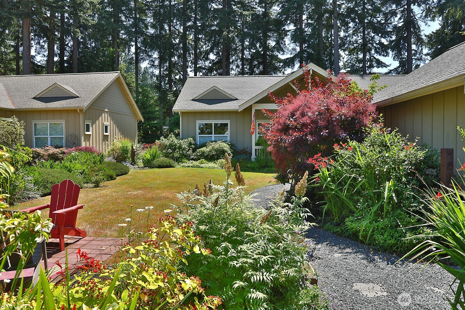 1050 Village Loop Langley, WA 98260 - Photo 5 of 39 a front view of house with yard and trees around