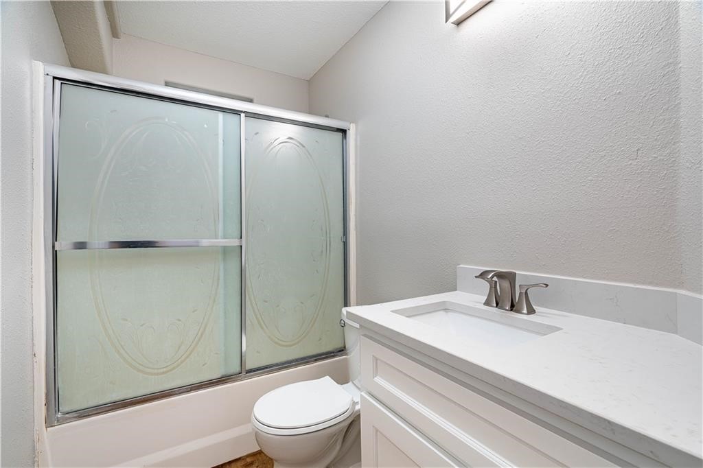 715 Bosquez Street Robstown, TX 78380 - Photo 13 of 18 a bathroom with a sink toilet and shower