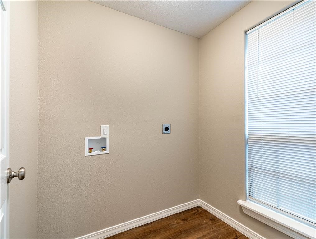 715 Bosquez Street Robstown, TX 78380 - Photo 14 of 18 a view of a small space with wooden floor and a window