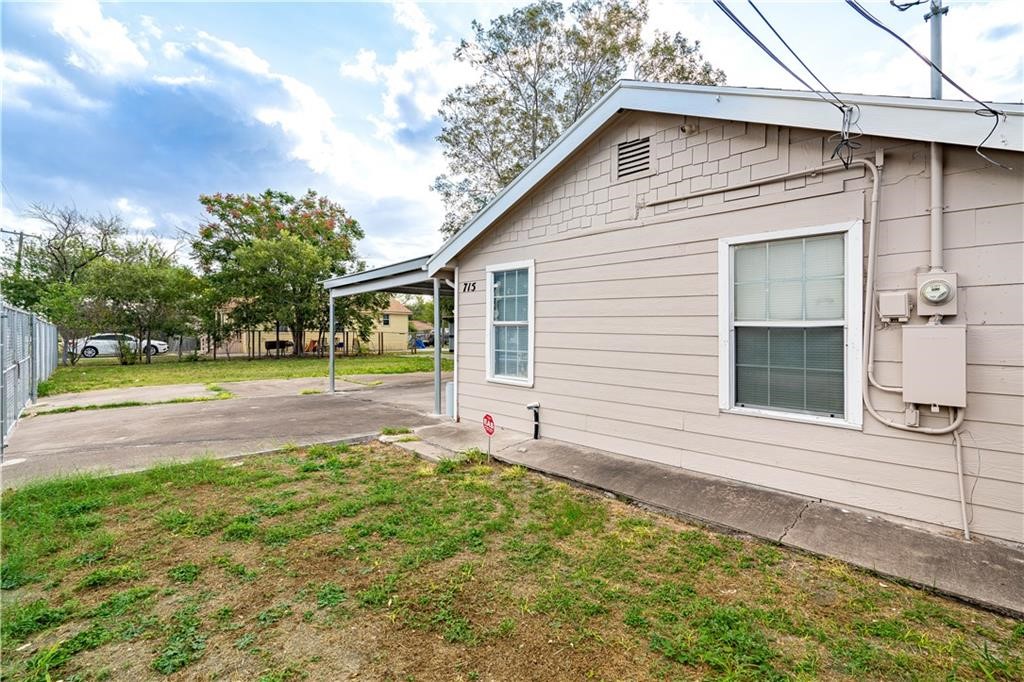 715 Bosquez Street Robstown, TX 78380 - Photo 16 of 18 a view of a house with a yard