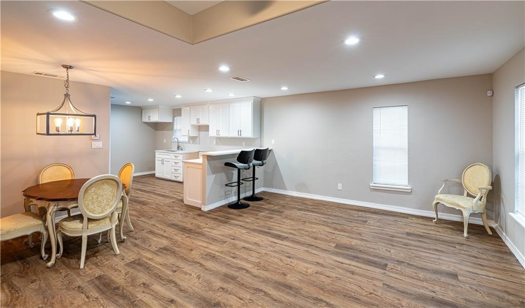 715 Bosquez Street Robstown, TX 78380 - Photo 8 of 18 a view of a dining room with furniture and wooden floor