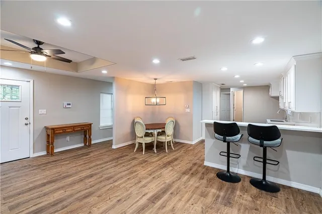 a view of a livingroom with furniture and a kitchen