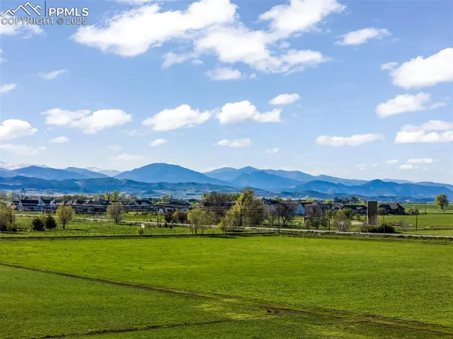 a view of an houses with outdoor view and green space