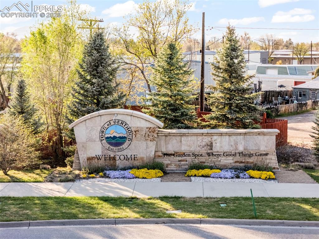1805 West County Road 8 Berthoud, CO 80513 - Photo 18 of 48 a view of swimming pool with outdoor seating and plants