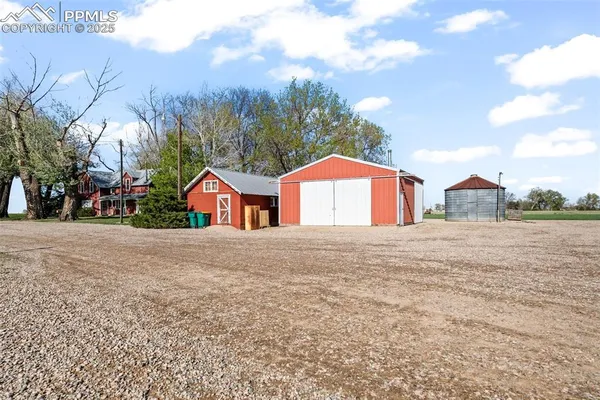 a view of street along with residential houses