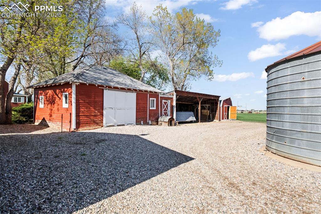 1805 West County Road 8 Berthoud, CO 80513 - Photo 26 of 48 a front view of a house with a yard and garage