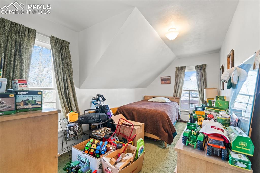 1805 West County Road 8 Berthoud, CO 80513 - Photo 38 of 48 a bedroom with bed and a window