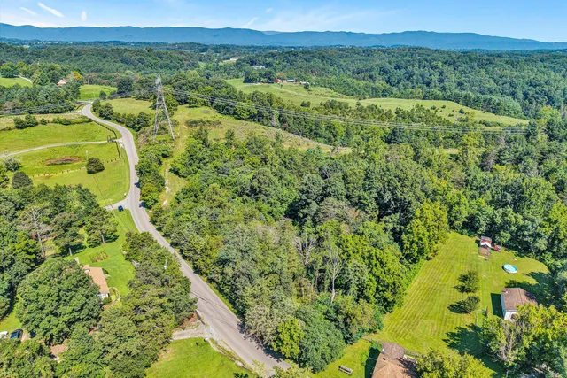 a view of a yard with an outdoor seating
