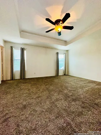 a view of a big room with carpet