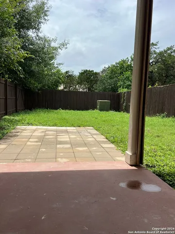 a view of backyard with green space