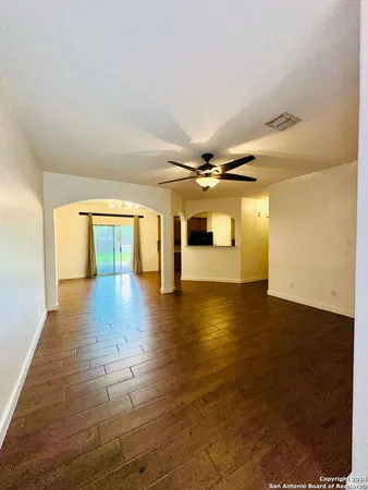 a view of a livingroom with wooden floor