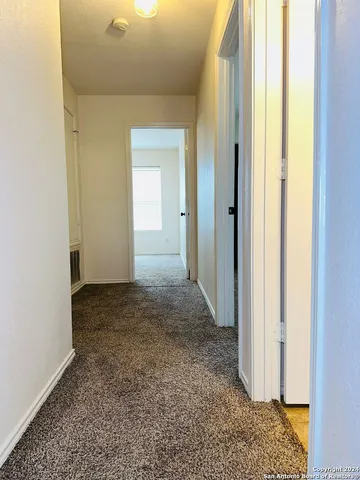a view of a bathroom with a glass door
