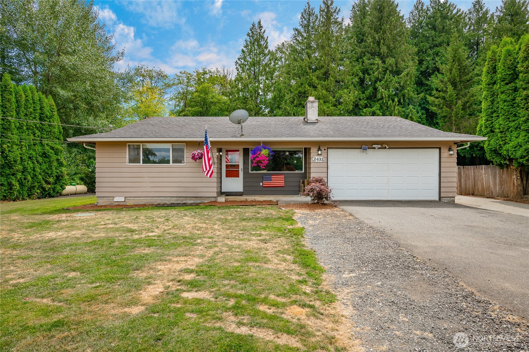 2433 Loomis Trail Road Custer, WA 98240 - Photo 1 of 31 a front view of a house with a yard and garage