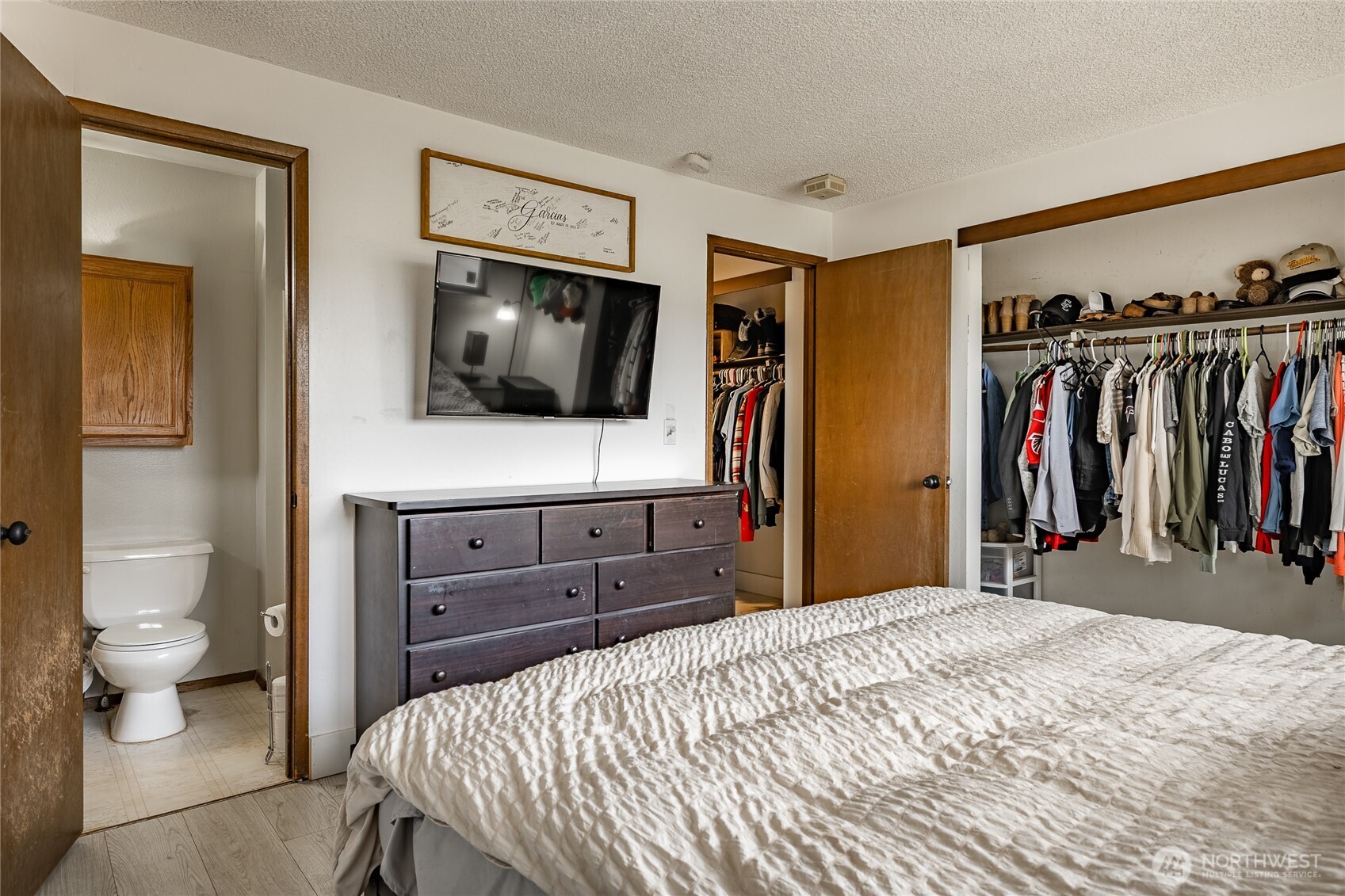 2433 Loomis Trail Road Custer, WA 98240 - Photo 25 of 31 a bedroom with a bed and a flat screen tv
