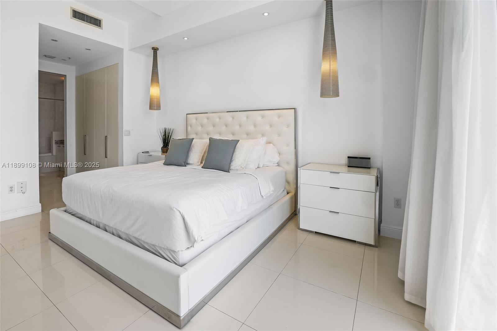 2001 Meridian Avenue, Unit 506 Miami Beach, FL 33139 - Photo 14 of 40 a large white bed in a white room