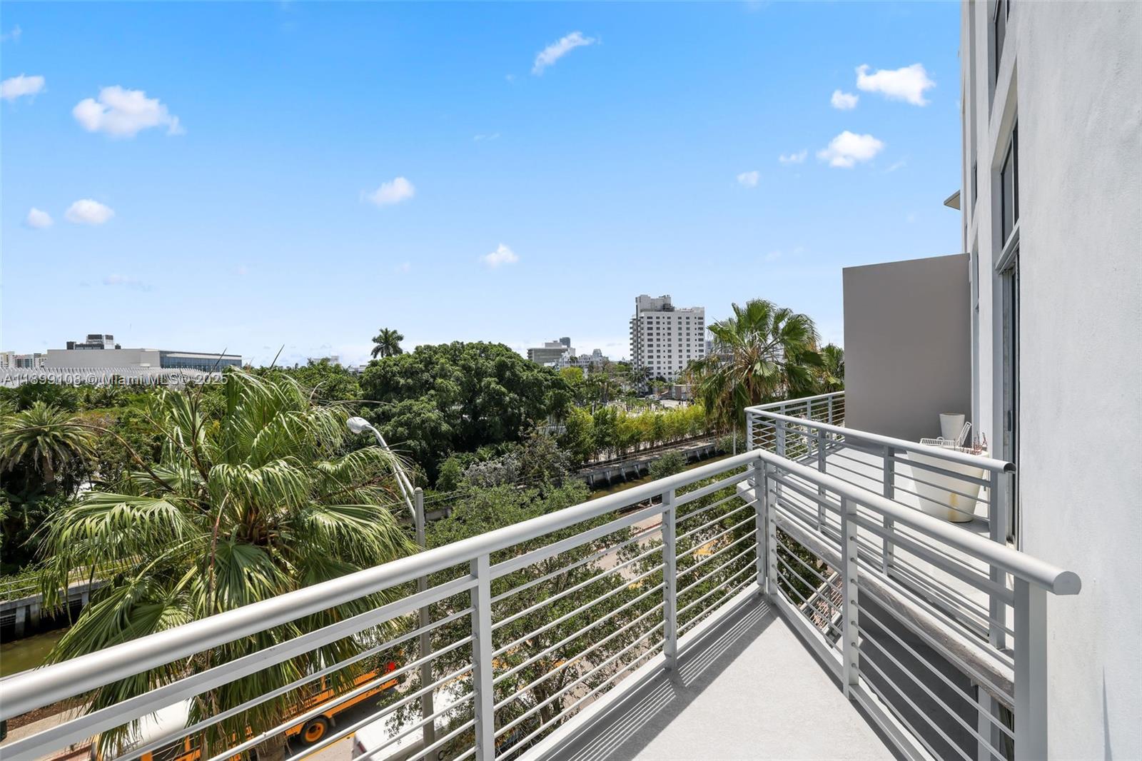 2001 Meridian Avenue, Unit 506 Miami Beach, FL 33139 - Photo 23 of 40 a view of balcony with lots of trees