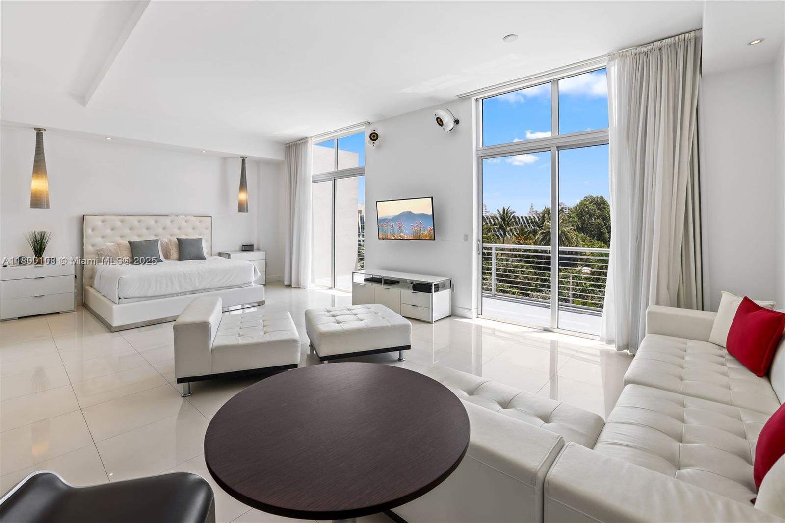 2001 Meridian Avenue, Unit 506 Miami Beach, FL 33139 - Photo 10 of 40 a living room with furniture and a large window