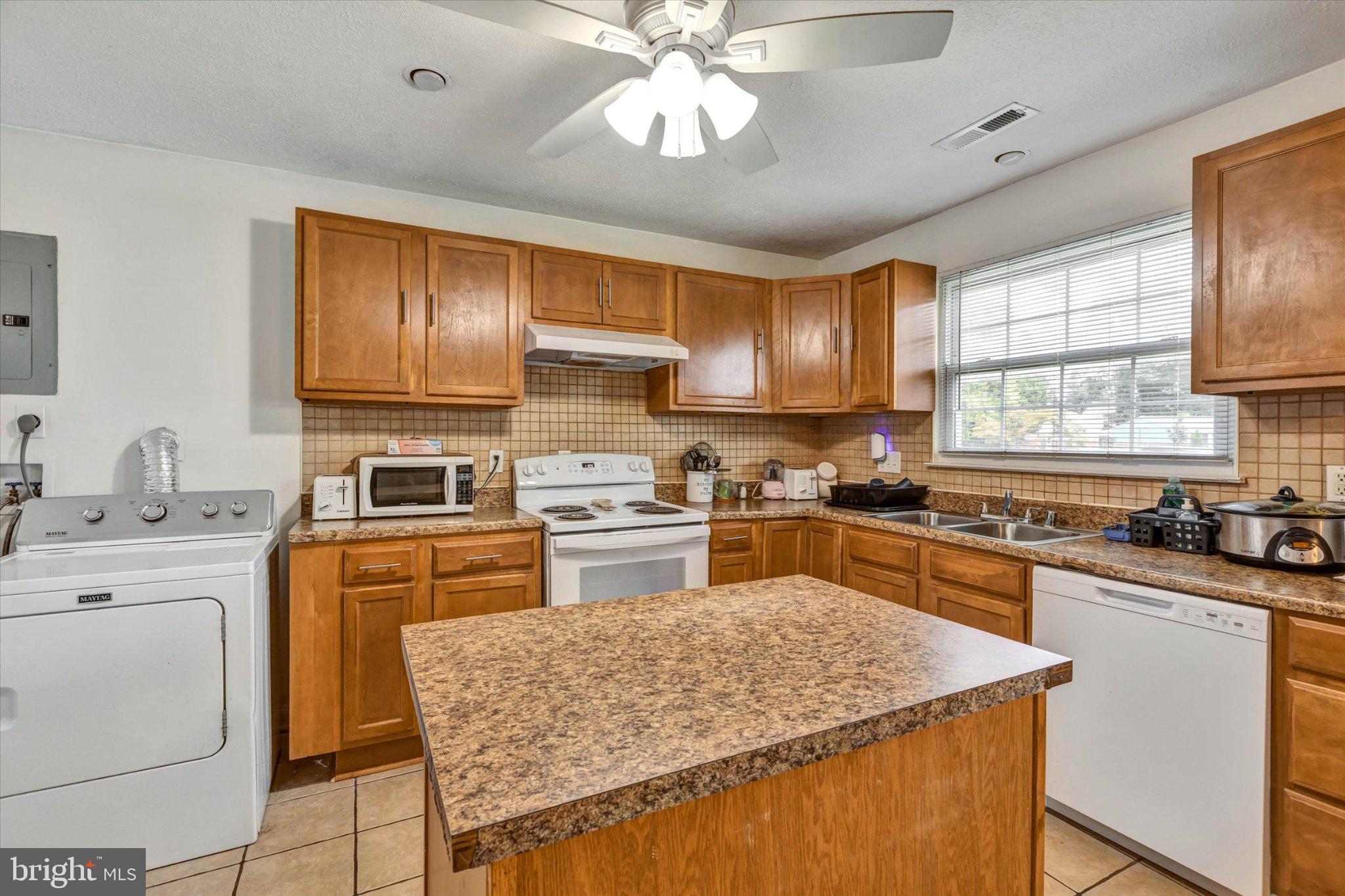 7167 Fairbrook Road Windsor Mill, MD 21244 - Photo 27 of 34 Cozy kitchen with warm wood accents.