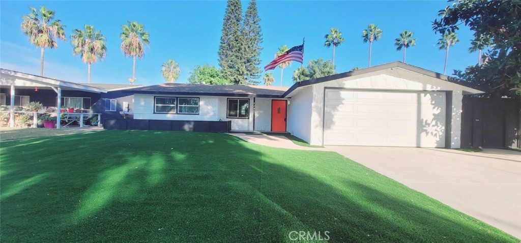 824 South Aspen Street Anaheim, CA 92802 - Photo 1 of 1 a front view of a house with a yard and potted plants