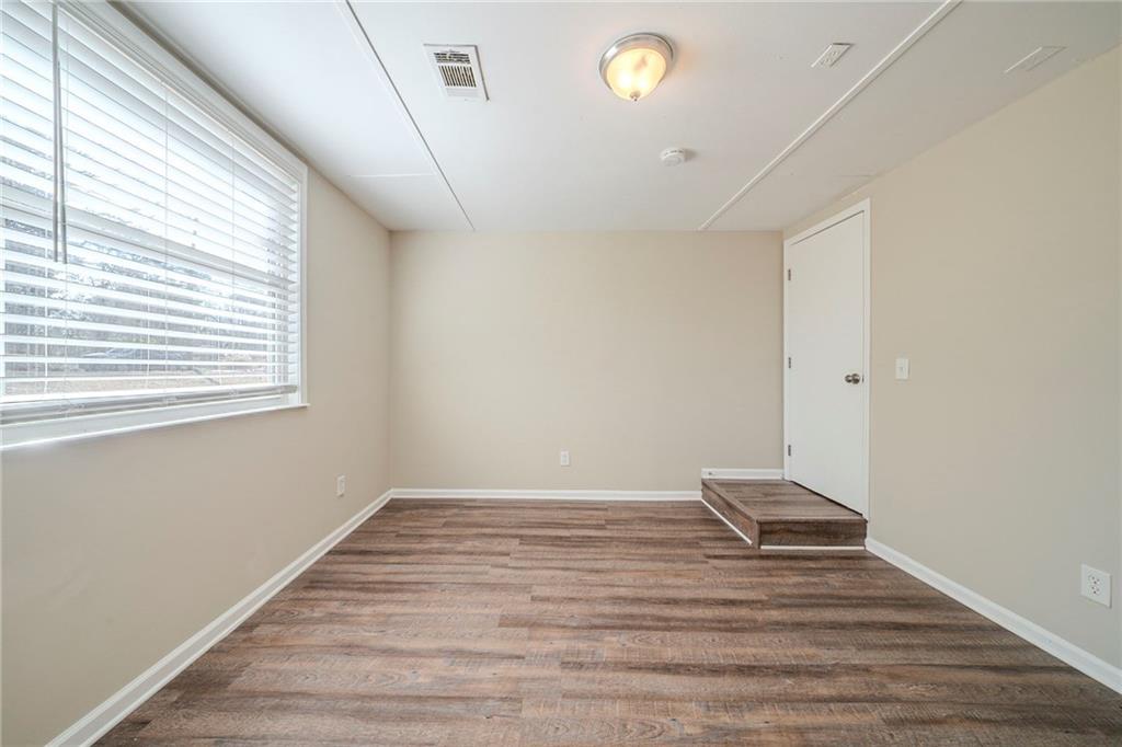 1433 Dennis Drive Decatur, GA 30032 - Photo 19 of 28 a view of wooden floor and windows in a room