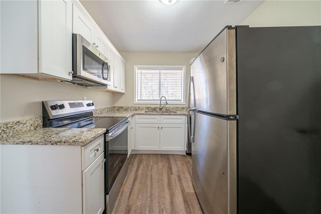 1433 Dennis Drive Decatur, GA 30032 - Photo 2 of 28 a kitchen with a sink stove and refrigerator