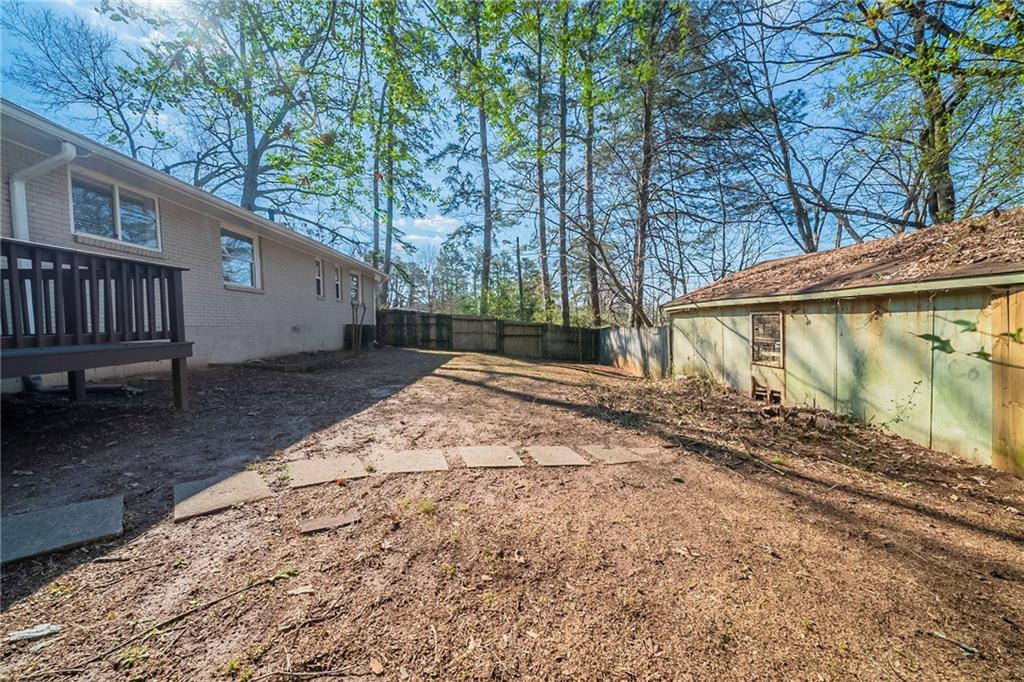 1433 Dennis Drive Decatur, GA 30032 - Photo 28 of 28 a view of a backyard with a small cabin