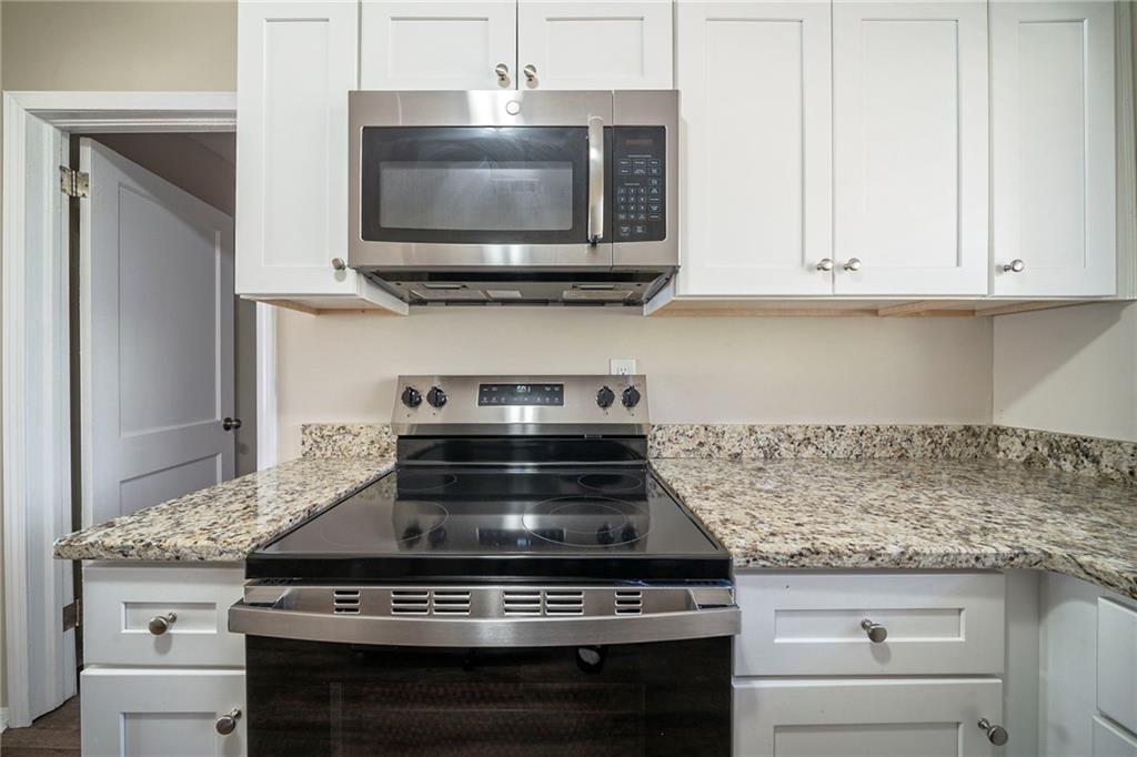 1433 Dennis Drive Decatur, GA 30032 - Photo 4 of 28 a stove top oven sitting inside of a kitchen