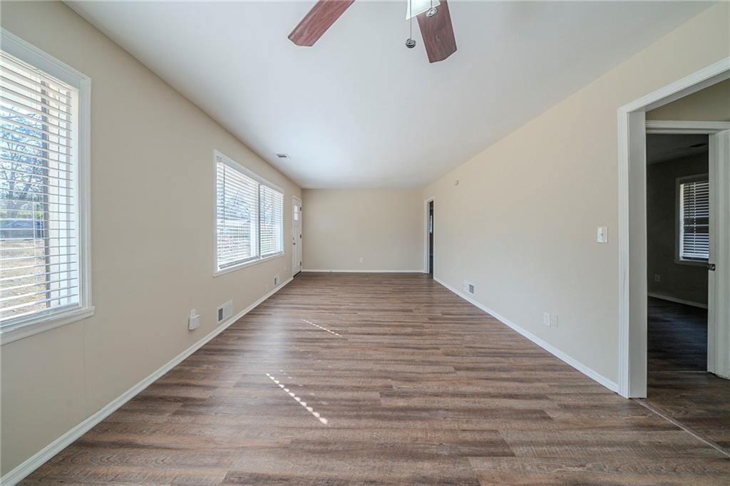 1433 Dennis Drive Decatur, GA 30032 - Photo 6 of 28 wooden floor in an empty room with a window