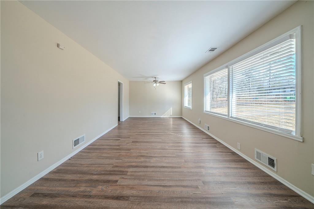 1433 Dennis Drive Decatur, GA 30032 - Photo 7 of 28 wooden floor in an empty room with a window