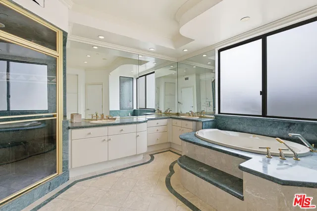 a bathroom with a double vanity sink mirror and double