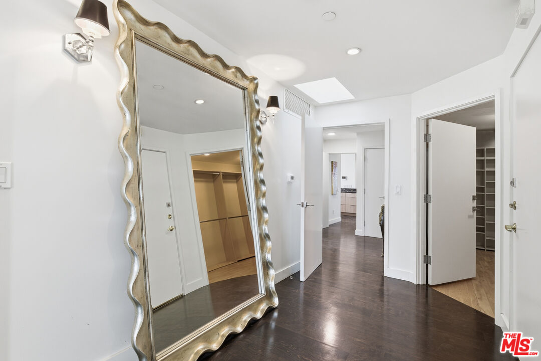 121 South Canon Drive, Unit PH 401 Beverly Hills, CA 90212 - Photo 23 of 31 a view of a hallway with wooden floor and entryway