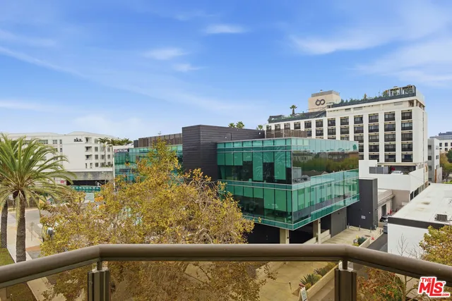 a view of balcony with outdoor seating and city view