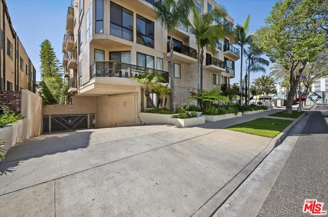 a view of a building with a yard