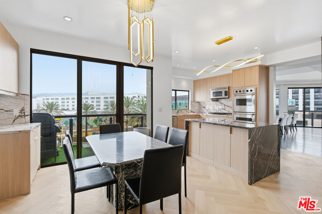 121 South Canon Drive, Unit PH 401 Beverly Hills, CA 90212 - Photo 7 of 31 a view of a dining room with furniture window and outside view