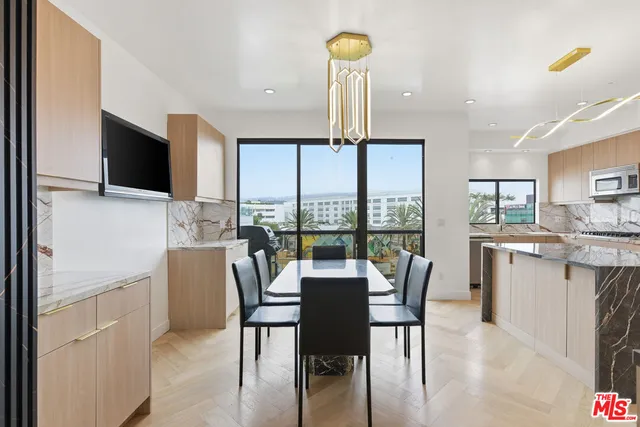 a view of a dining room with furniture window and outside view