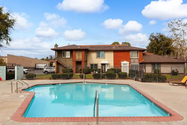a view of a house with swimming pool