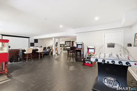 a living room with furniture and kitchen view