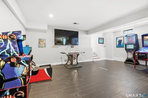 a living room with furniture and flat screen tv