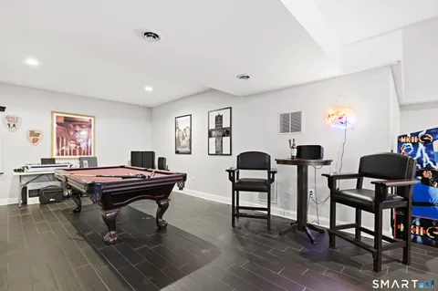 a work room with furniture and wooden floor