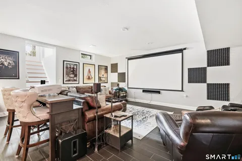 a view of a livingroom with furniture and a flat screen tv