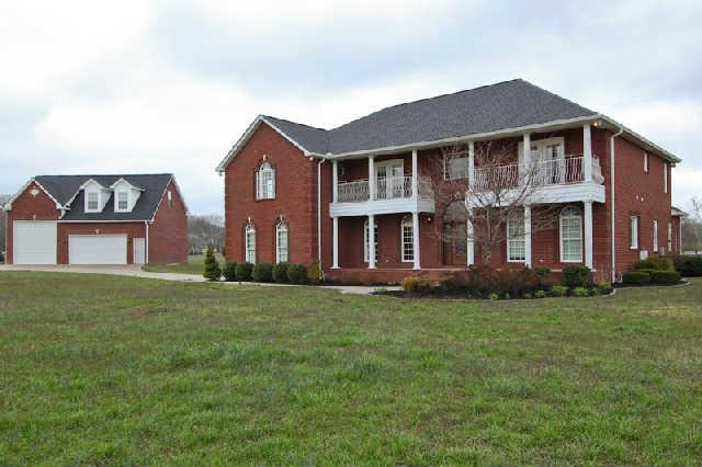 2210 Skinner Road Arrington, TN 37014 - Photo 1 of 20 Surrounded by beautiful countryside and situated on 5 acres....Enjoy this elegant country home custom built and perfect for professional that enjoys privacy. Please notice detached garage with two level expansion space.