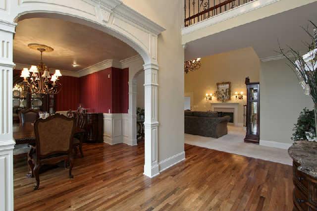 2210 Skinner Road Arrington, TN 37014 - Photo 5 of 20 Your guests will enjoy this view of your luxurious formal living areas as soon as they enter. Gorgeous rosewood flooring and beautifully detailing moldings enhance these spaces.