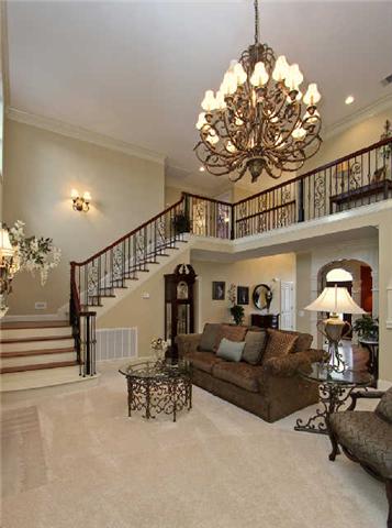 2210 Skinner Road Arrington, TN 37014 - Photo 7 of 20 View of living room and stairway to upper level.. Don't miss rosewood stair treads and custom wrought iron railing