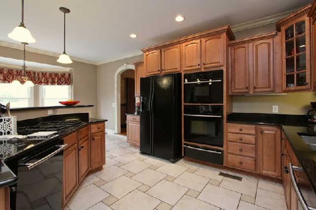 2210 Skinner Road Arrington, TN 37014 - Photo 8 of 20 Welcoming kitchen with lots of cabinets for your cooking and baking needs as well as dinnerware. Please notice custom tile flooring