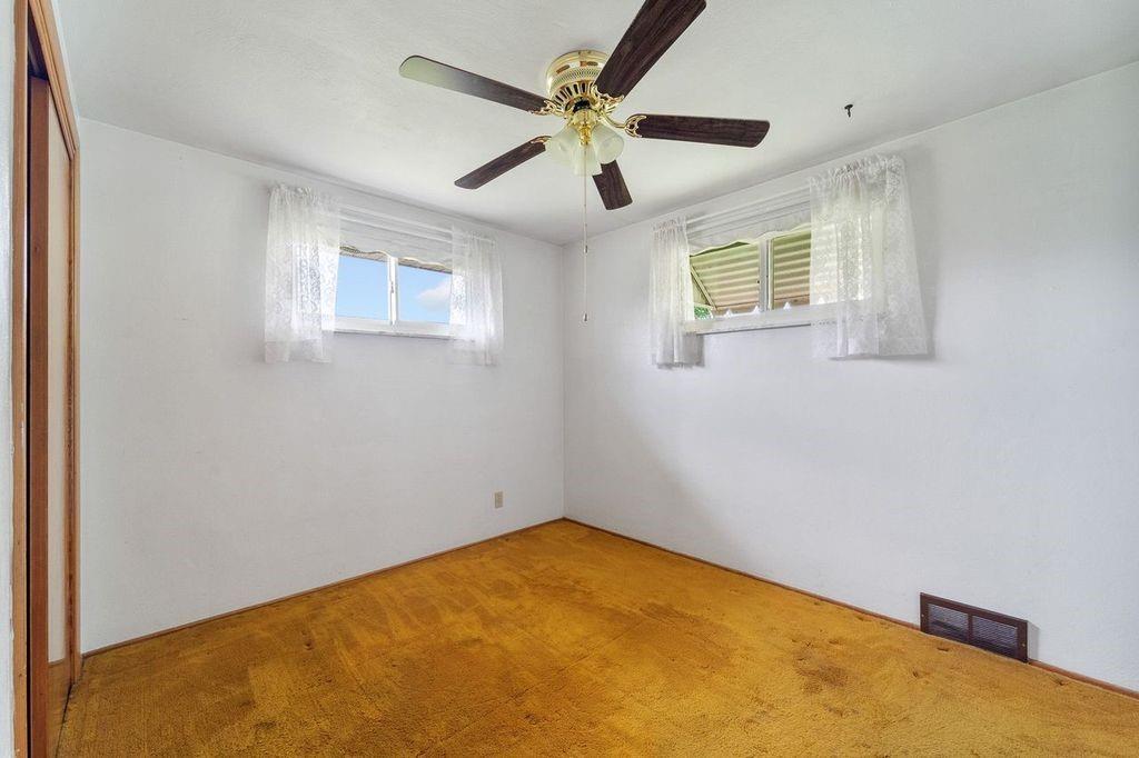 506 Vaneal Road Washington, PA 15301 - Photo 16 of 25 an empty room with ceiling fan and window