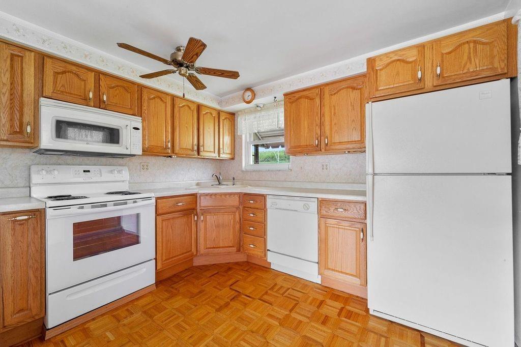 506 Vaneal Road Washington, PA 15301 - Photo 7 of 25 a kitchen with stainless steel appliances granite countertop a refrigerator a stove top oven a sink and dishwasher