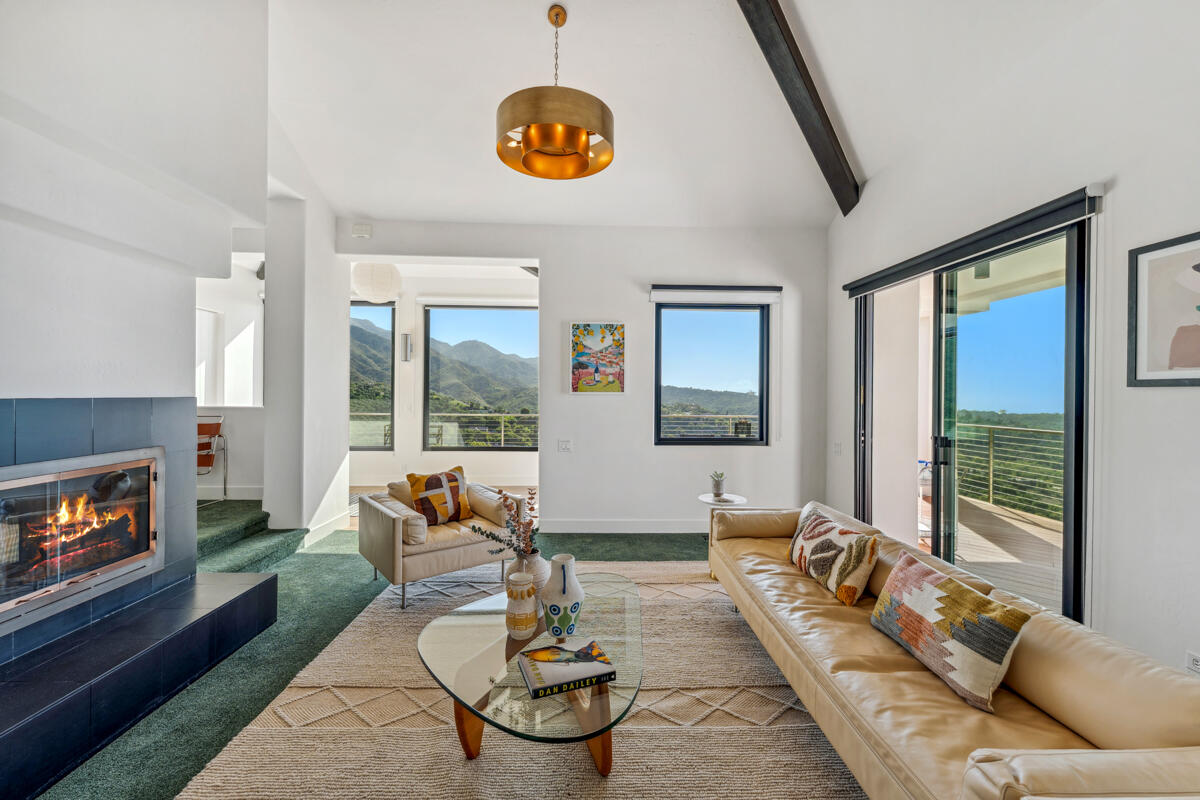 2870 Holly Road Santa Barbara, CA 93105 - Photo 12 of 39 a living room with furniture and a fireplace