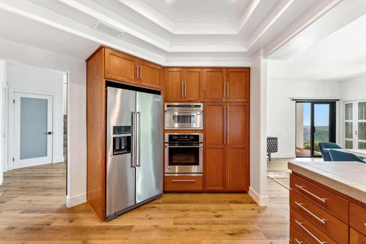 2870 Holly Road Santa Barbara, CA 93105 - Photo 21 of 39 a kitchen with stainless steel appliances granite countertop a refrigerator and a sink